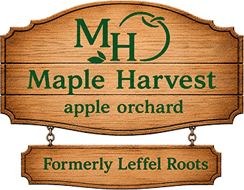 Maple Harvest Apple Orchard sign, with a plaque reading Formerly Leffel Roots
